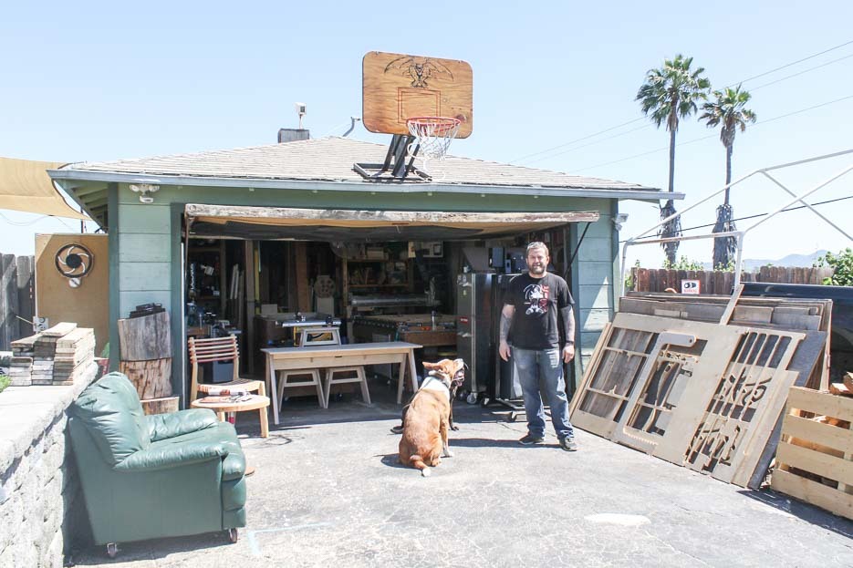 Kyle and his dogs outside his workshop in the Californian sun