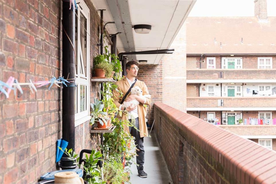 Lynton standing outside his front door