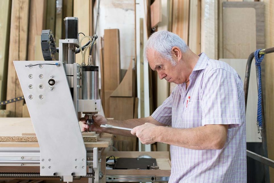 Sergi operating his CNC machine